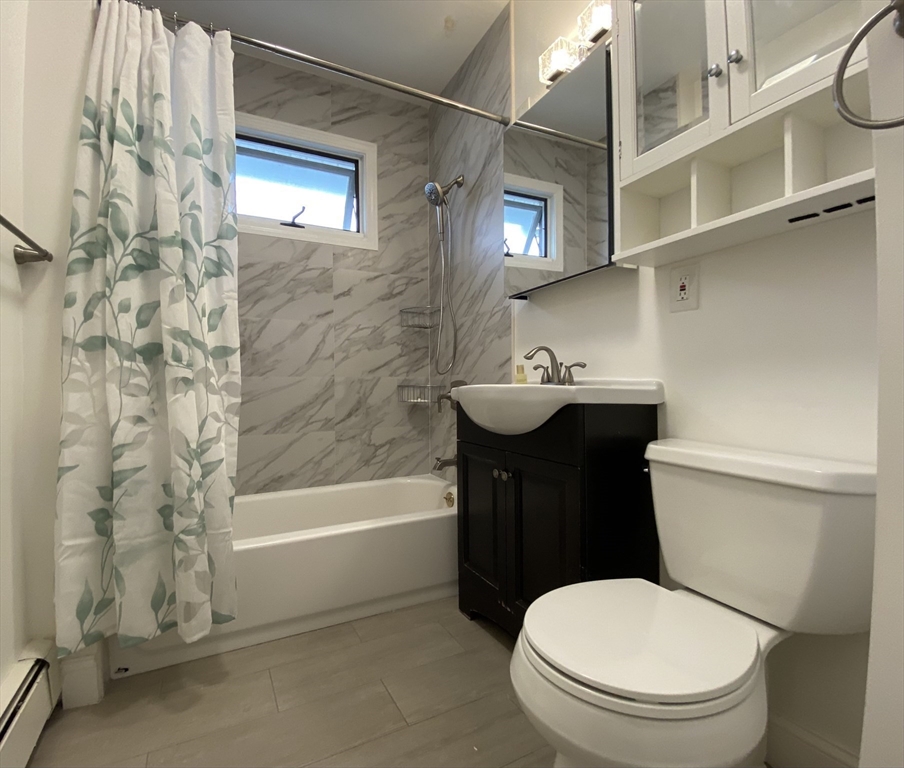 21 Heldun Street, Unit 2 Boston, MA 02132 - Photo 16 of 19 a bathroom with a sink a toilet and shower