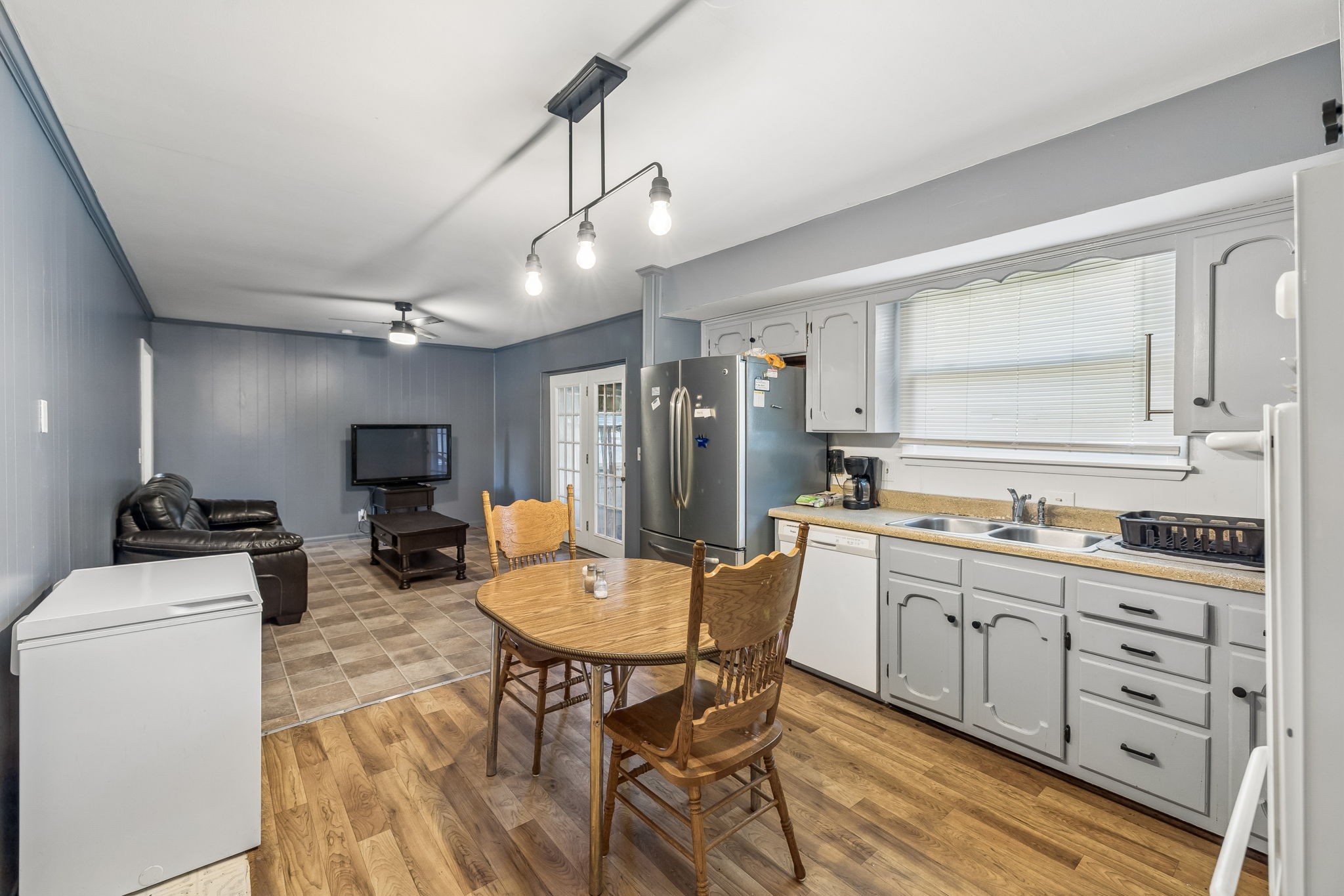 1246 Apache Lane Madison, TN 37115 - Photo 7 of 21 a kitchen with stainless steel appliances kitchen island granite countertop a sink a stove a refrigerator cabinets and chairs