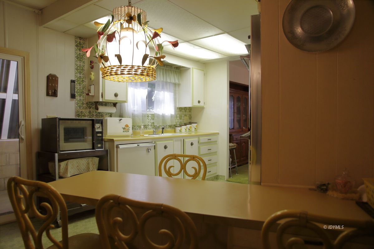 46 Pine Cove Road Idyllwild, CA 92549 - Photo 13 of 24 a kitchen with a refrigerator and a stove