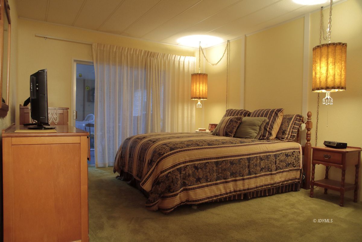 46 Pine Cove Road Idyllwild, CA 92549 - Photo 16 of 24 a bedroom with a bed and dresser