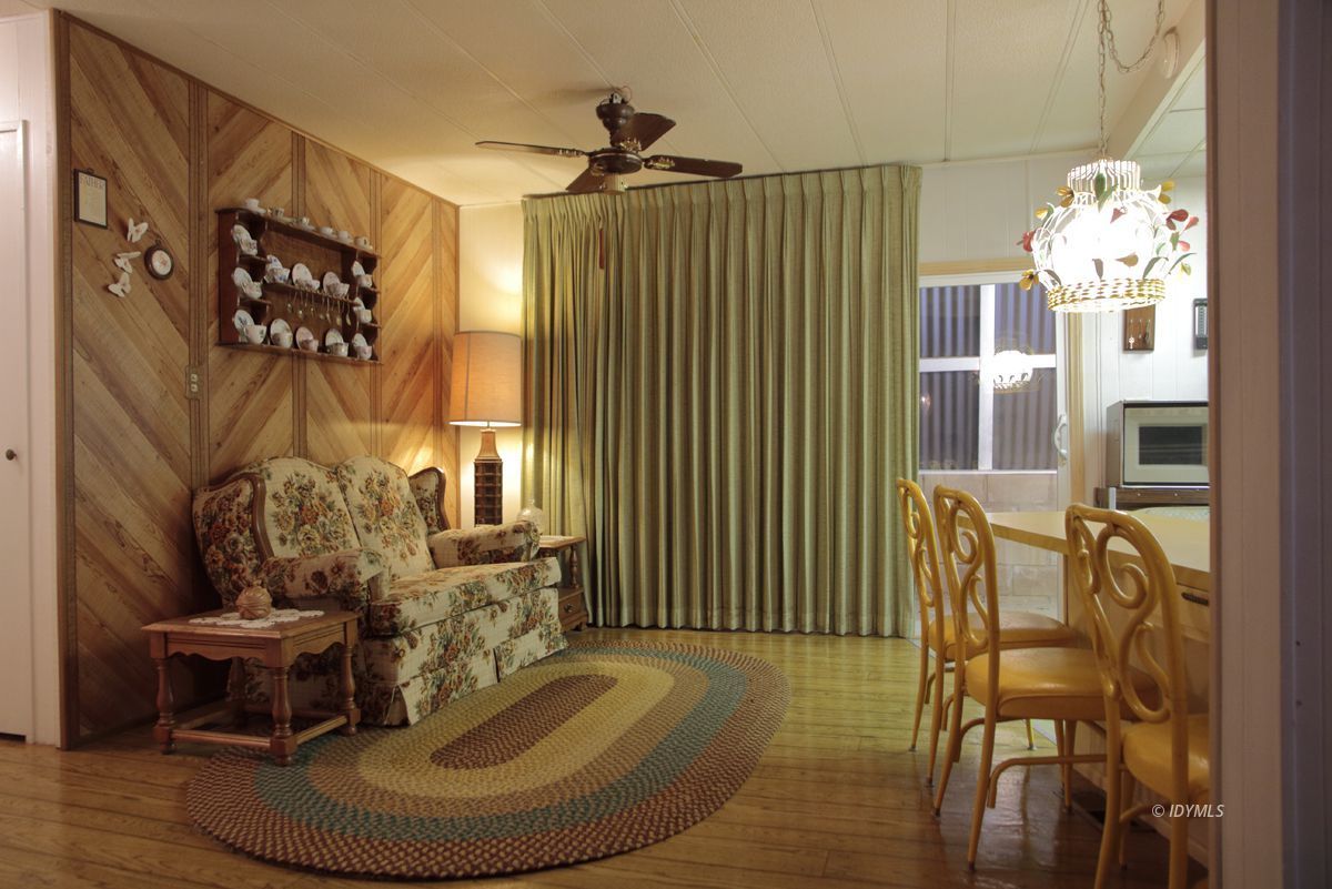 46 Pine Cove Road Idyllwild, CA 92549 - Photo 9 of 24 a living room with furniture and a chandelier