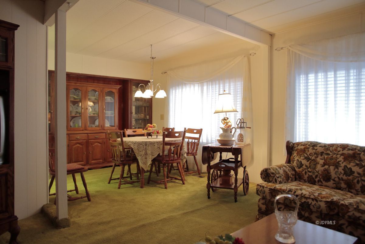 46 Pine Cove Road Idyllwild, CA 92549 - Photo 10 of 24 a living room with furniture a dining table and chairs with wooden floor