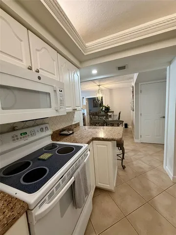 a kitchen with a stove and a sink