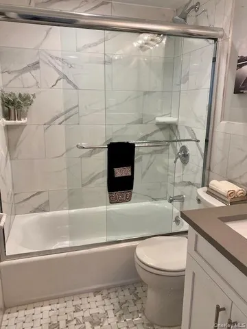 a bathroom with a sink a toilet and a bathtub