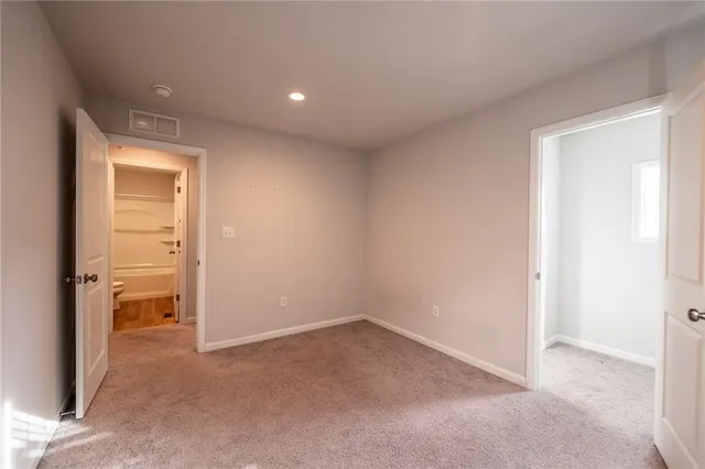 a view of an empty room and a window