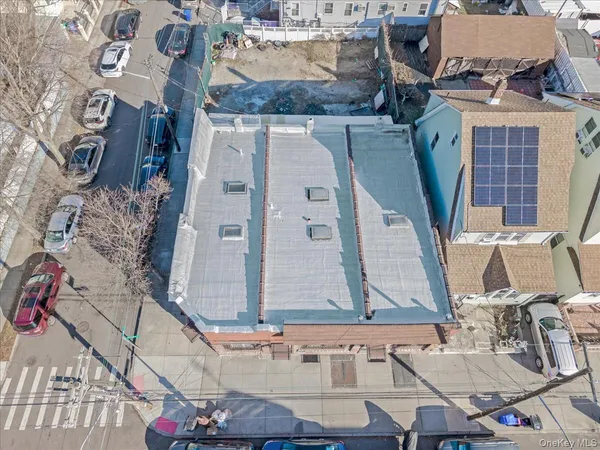 an aerial view of houses with outdoor space