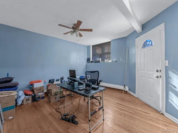 a work room with furniture and wooden floor