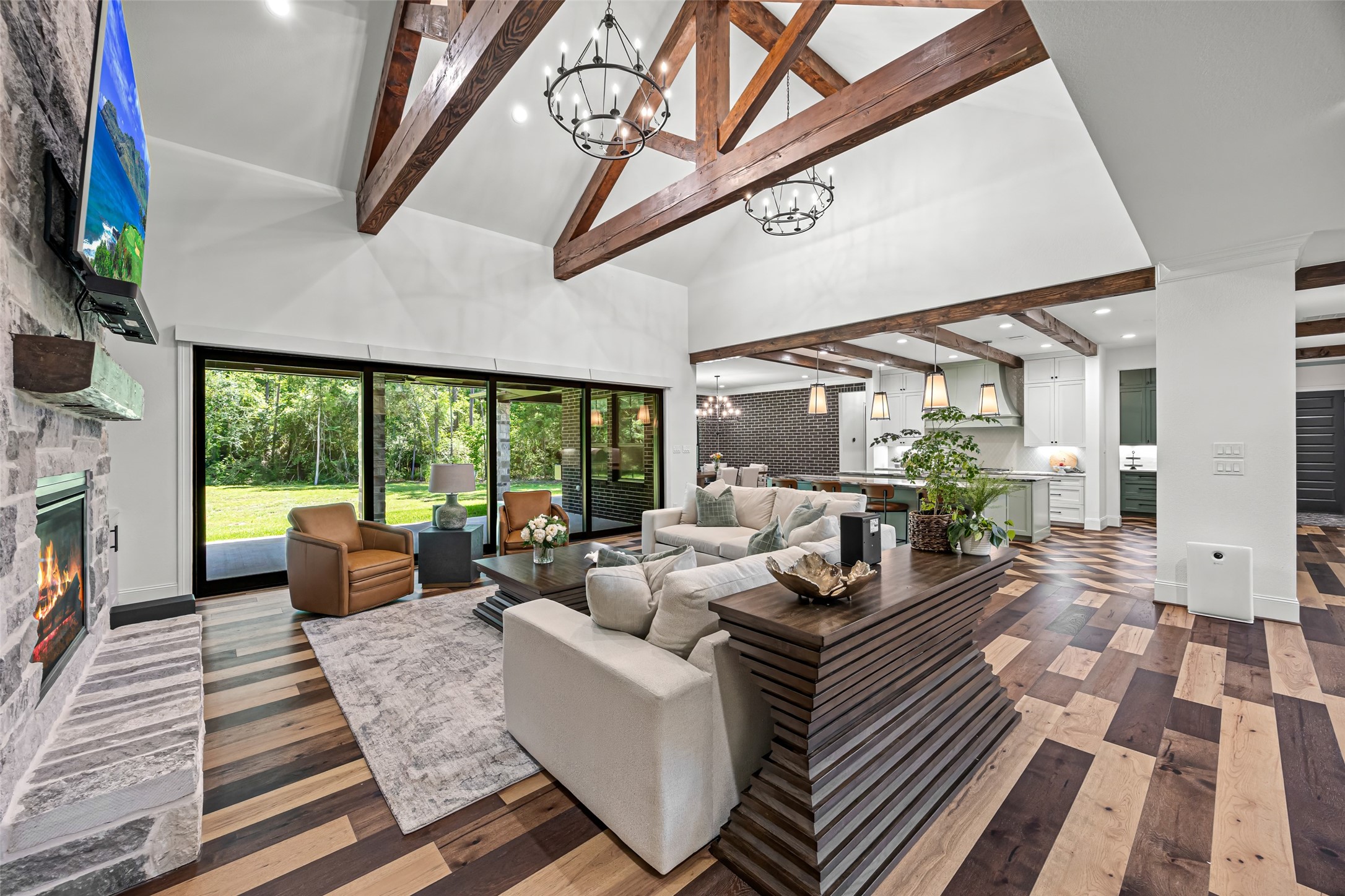 19314 Chateau Ridge Court Tomball, TX 77377 - Photo 5 of 50 Bright and airy living room with dramatic beams and designer finishes.