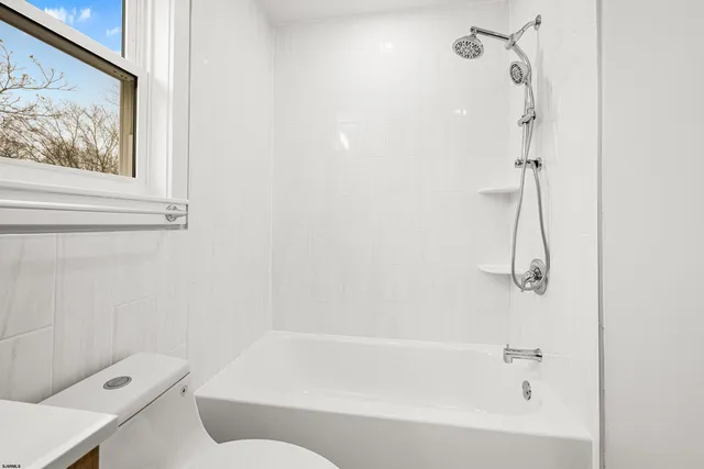 a view of a room with wooden furniture