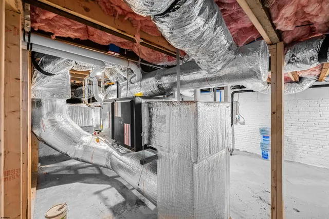 a brick building with a bench in front of it