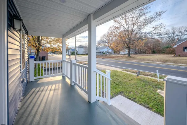 a view of a field with an ocean view