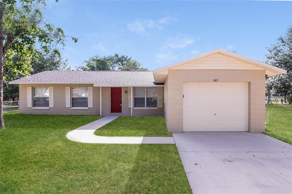 a view of a house with a yard