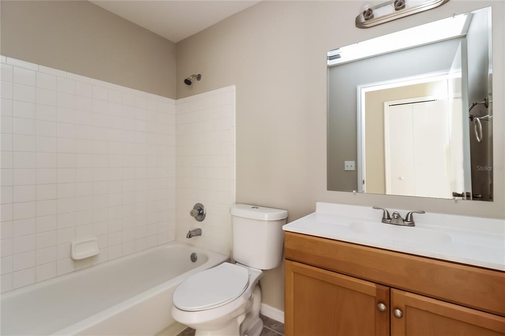 605 Dorothy Circle Eustis, FL 32726 - Photo 14 of 15 a bathroom with a sink a toilet and shower