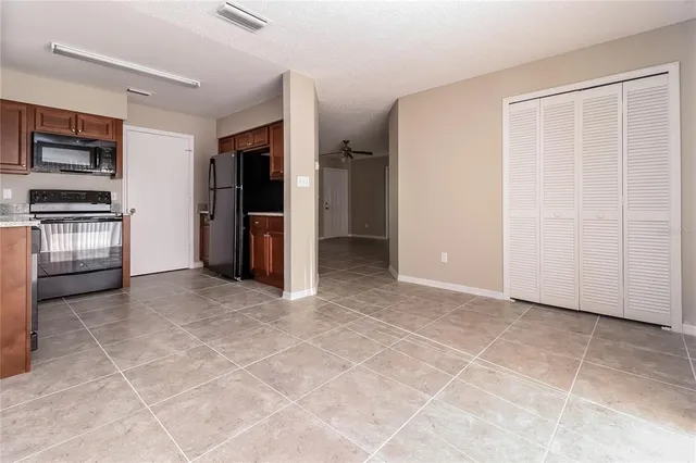 a view of a livingroom with a kitchen
