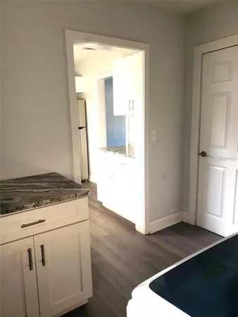 a stove top oven sitting inside of a kitchen