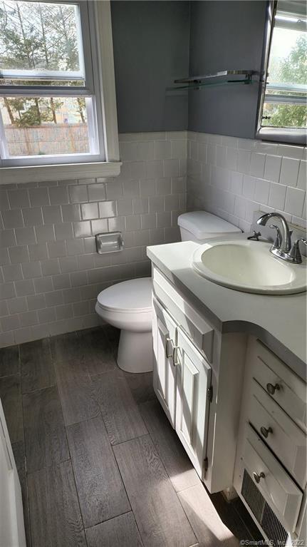 25 Madsen Road West Hartford, CT 06110 - Photo 8 of 16 a bathroom with a sink a toilet and a window