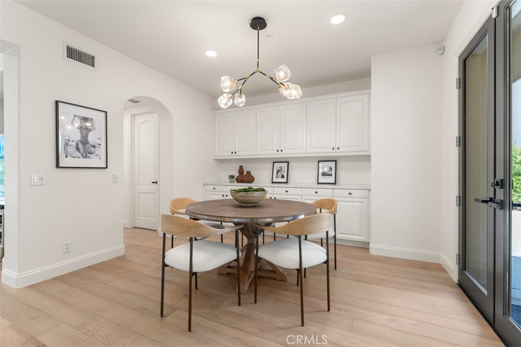 21 Via Nerisa San Clemente, CA 92673 - Photo 18 of 54 a view of a dining room with furniture a chandelier and wooden floor