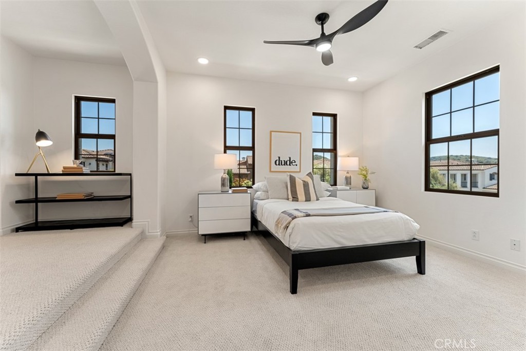 21 Via Nerisa San Clemente, CA 92673 - Photo 22 of 54 a bedroom with a bed lamp and a window