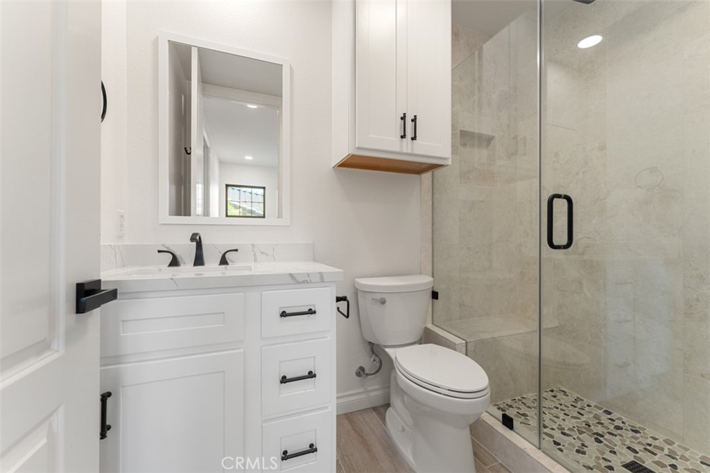 21 Via Nerisa San Clemente, CA 92673 - Photo 25 of 54 a bathroom with a sink toilet and shower