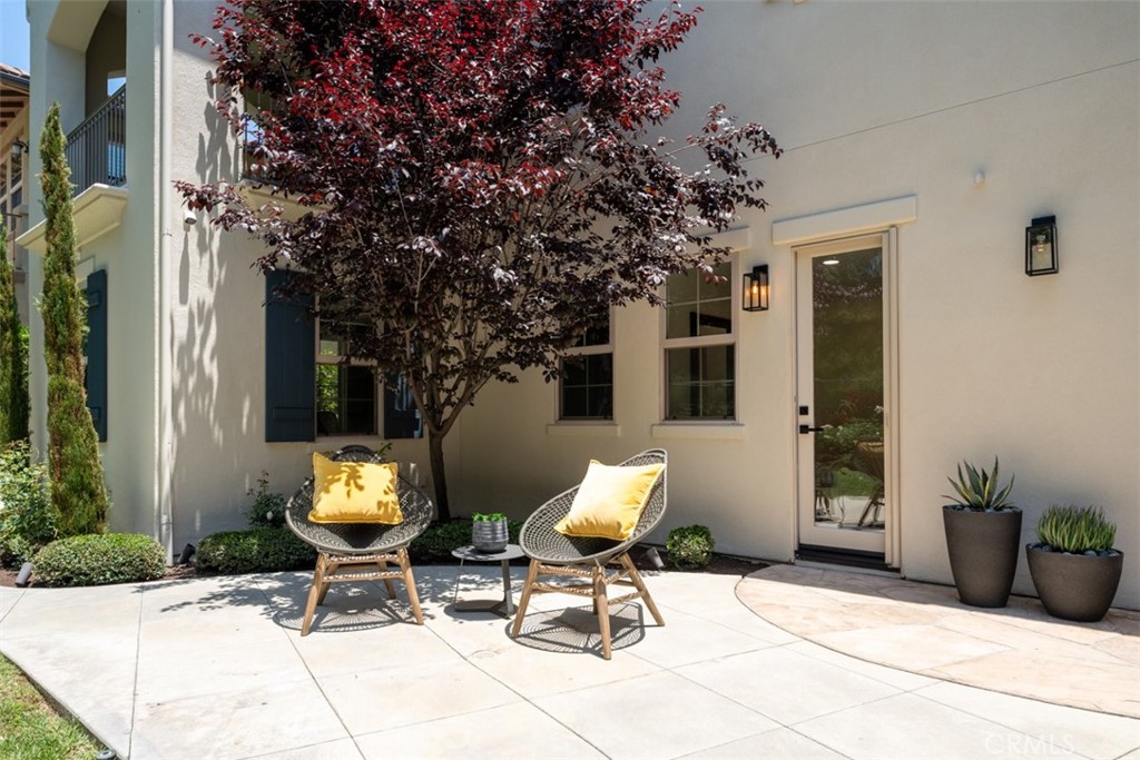 21 Via Nerisa San Clemente, CA 92673 - Photo 41 of 54 a view of a patio with a table and chairs and potted plants