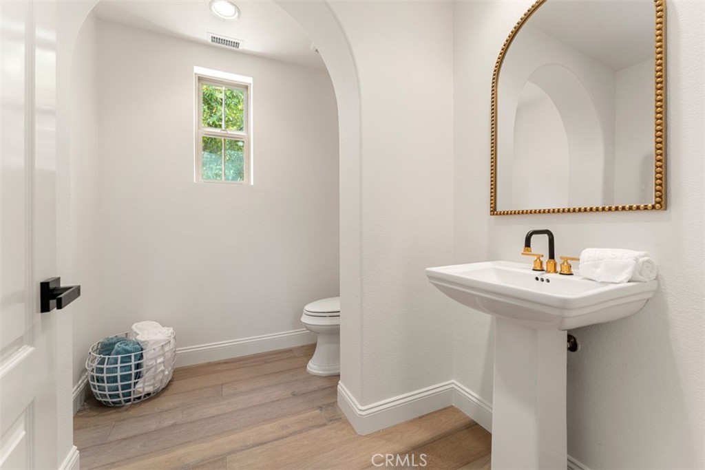 21 Via Nerisa San Clemente, CA 92673 - Photo 8 of 54 a bathroom with a sink toilet and a mirror