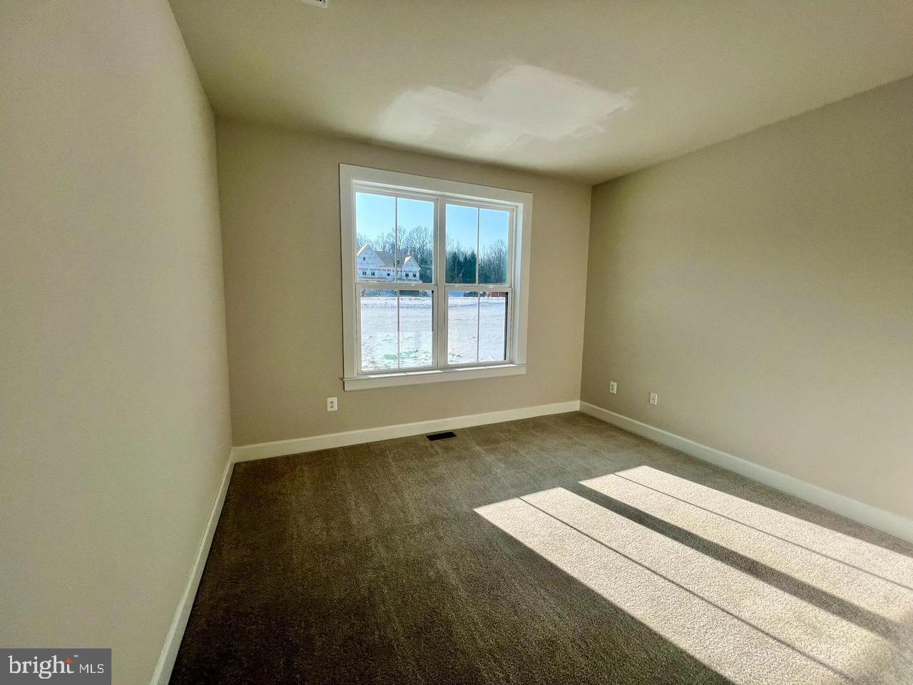 234 Coffman Drive Exton, PA 19341 - Photo 12 of 17 an empty room with wooden floor and windows