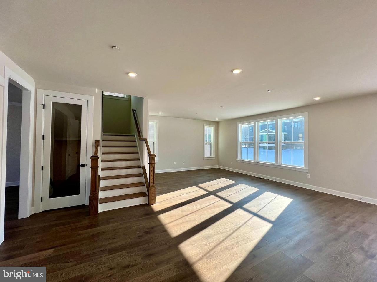 234 Coffman Drive Exton, PA 19341 - Photo 2 of 17 an empty room with wooden floor and windows