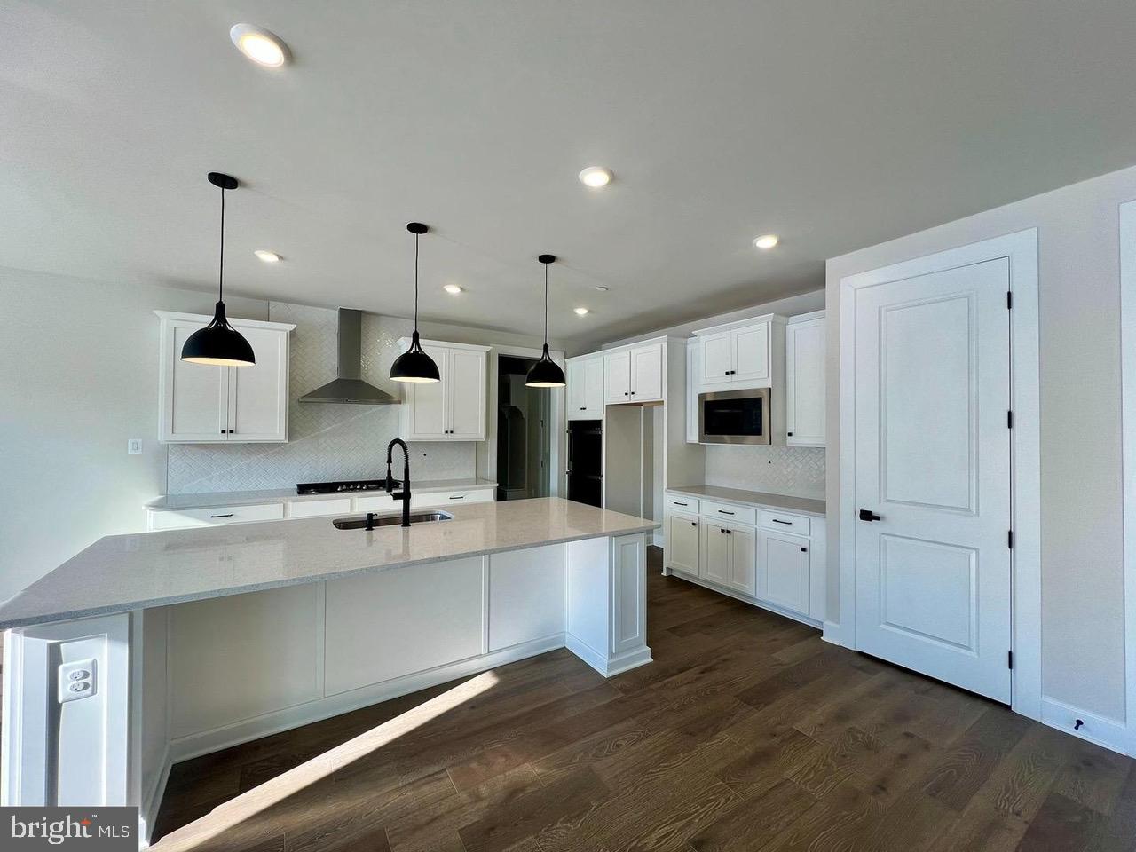 234 Coffman Drive Exton, PA 19341 - Photo 5 of 17 a large white kitchen with a stove and a sink