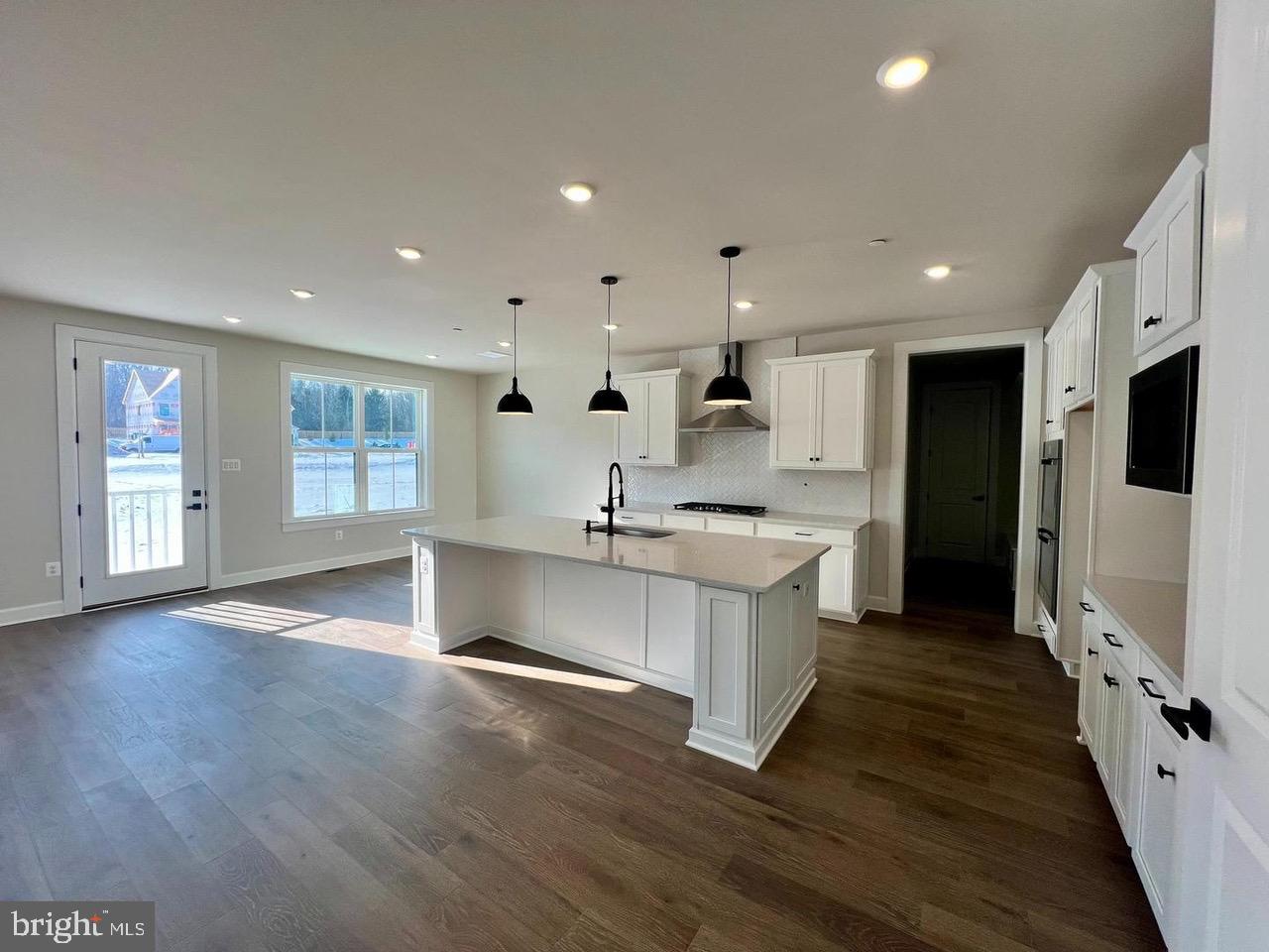 234 Coffman Drive Exton, PA 19341 - Photo 6 of 17 a large kitchen with stainless steel appliances kitchen island a large counter top and a wooden floors