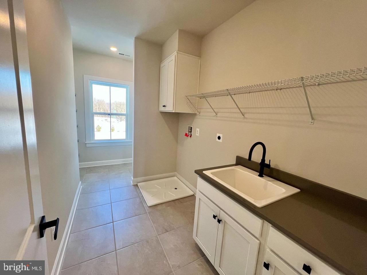 234 Coffman Drive Exton, PA 19341 - Photo 10 of 17 a kitchen with a sink and cabinets