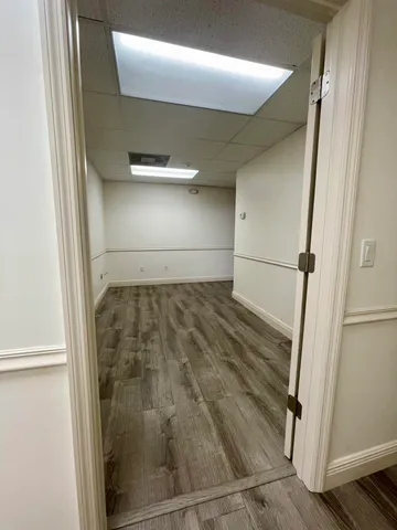 a bathroom with a glass shower door