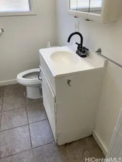 a bathroom with a sink toilet and vanity