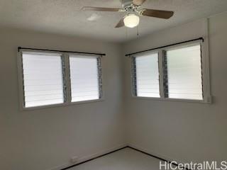 927 Spencer Street, Unit A1 Honolulu, HI 96822 - Photo 6 of 13 an empty room with a window