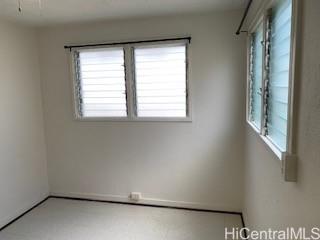 927 Spencer Street, Unit A1 Honolulu, HI 96822 - Photo 10 of 13 an empty room with a window