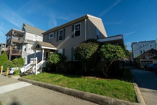 a front view of a house with a yard