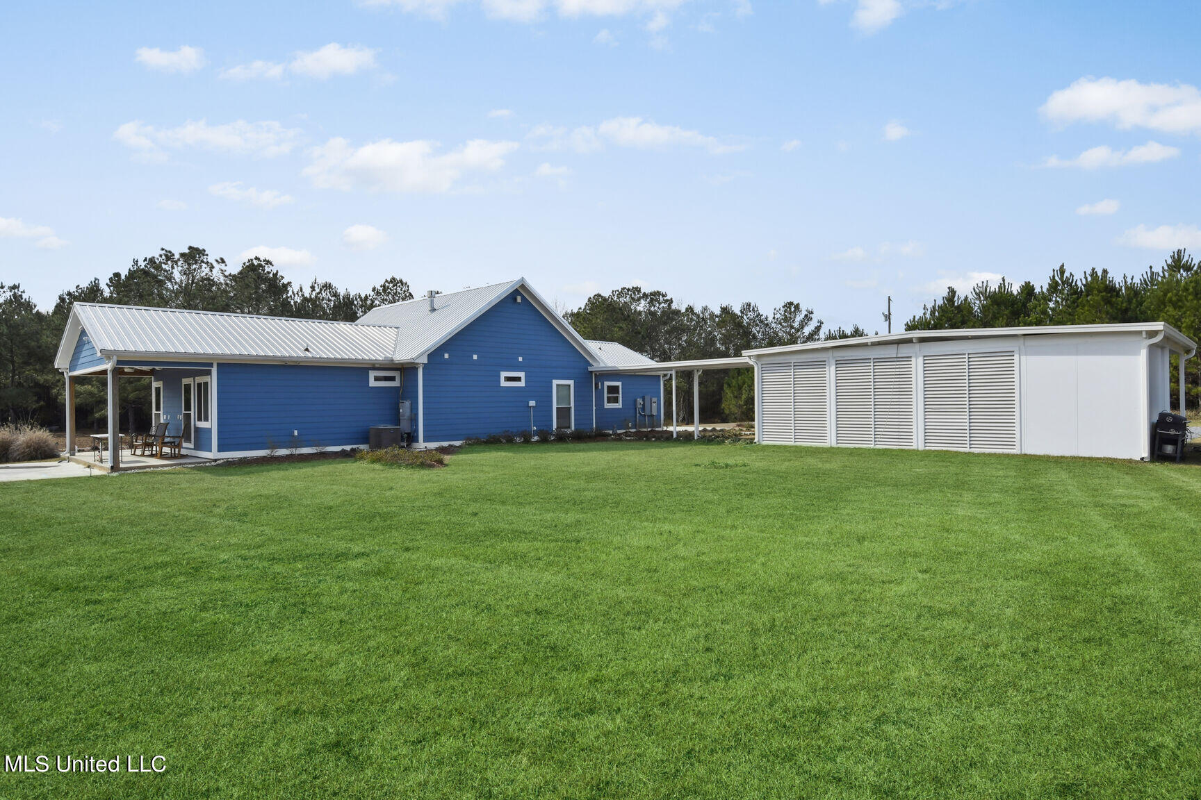75 3 Oaks Road Perkinston, MS 39573 - Photo 7 of 43 75 Three Oaks rear exterior