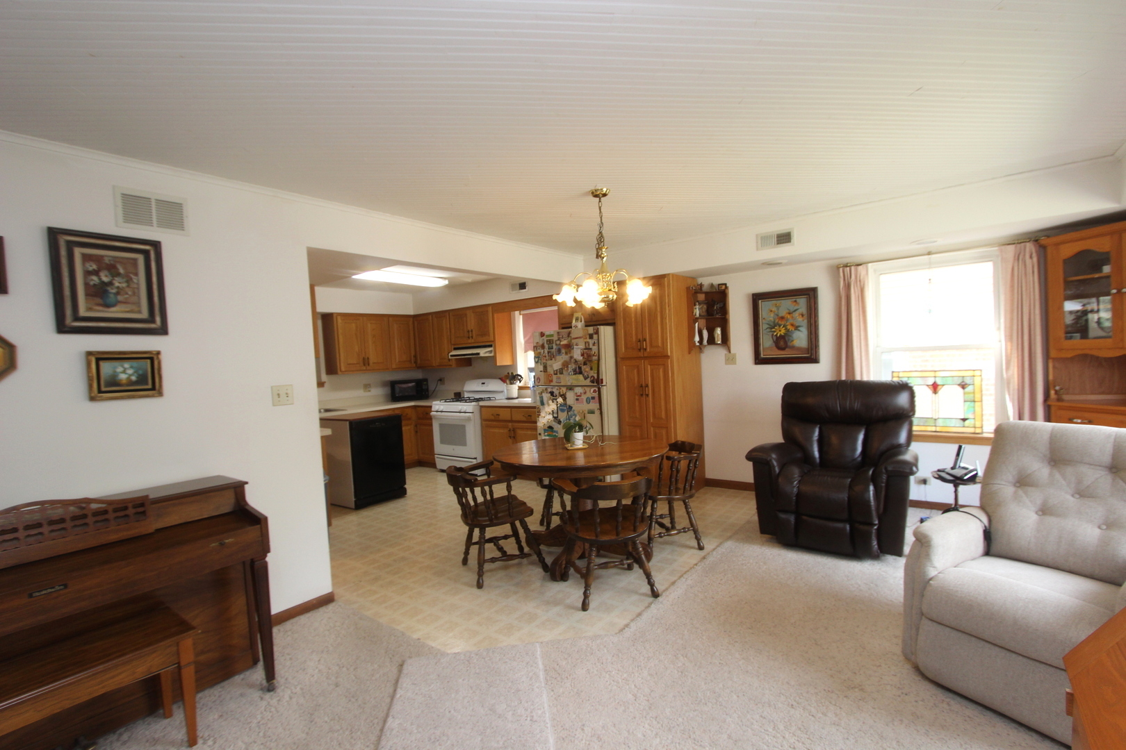 2457 Hawthorne Road Homewood, IL 60430 - Photo 4 of 20 a living room with furniture and a dining room