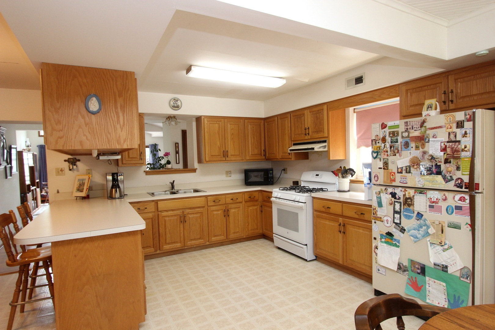 2457 Hawthorne Road Homewood, IL 60430 - Photo 5 of 20 a kitchen with stainless steel appliances kitchen island granite countertop a sink stove and refrigerator