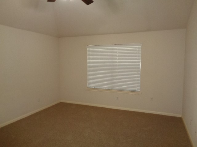 17136 Gleneagle Drive South Conroe, TX 77385 - Photo 11 of 19 an empty room with a window