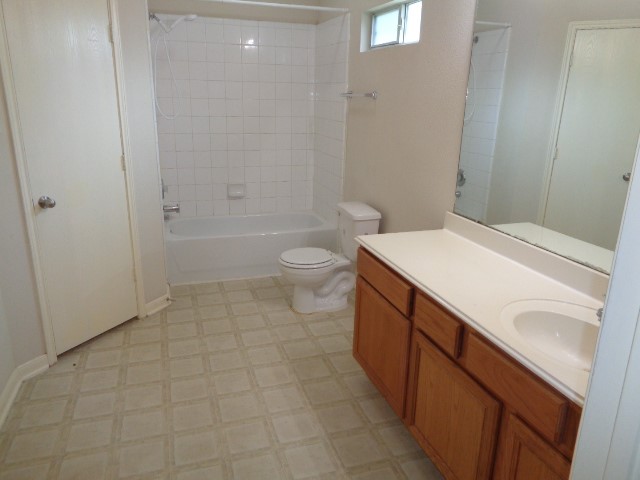 17136 Gleneagle Drive South Conroe, TX 77385 - Photo 12 of 19 a bathroom with a sink a toilet and shower