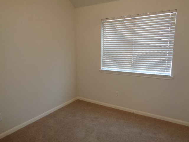 17136 Gleneagle Drive South Conroe, TX 77385 - Photo 13 of 19 an empty room with a window