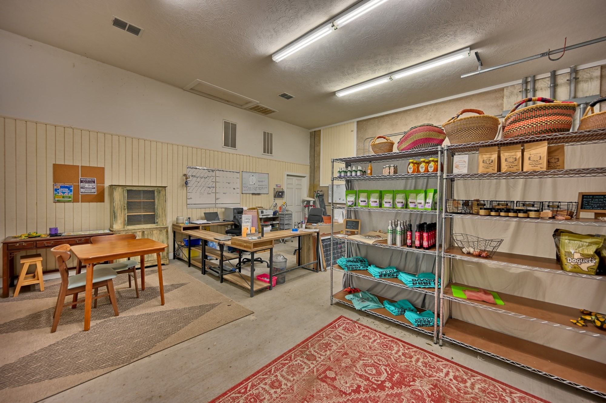 5255 Ganske Road Burton, TX 77835 - Photo 19 of 46 Inside shop... The Farm Store! This room features an organized workspace with a desk area and shelving units filled with various products. It has a cozy, functional atmosphere.