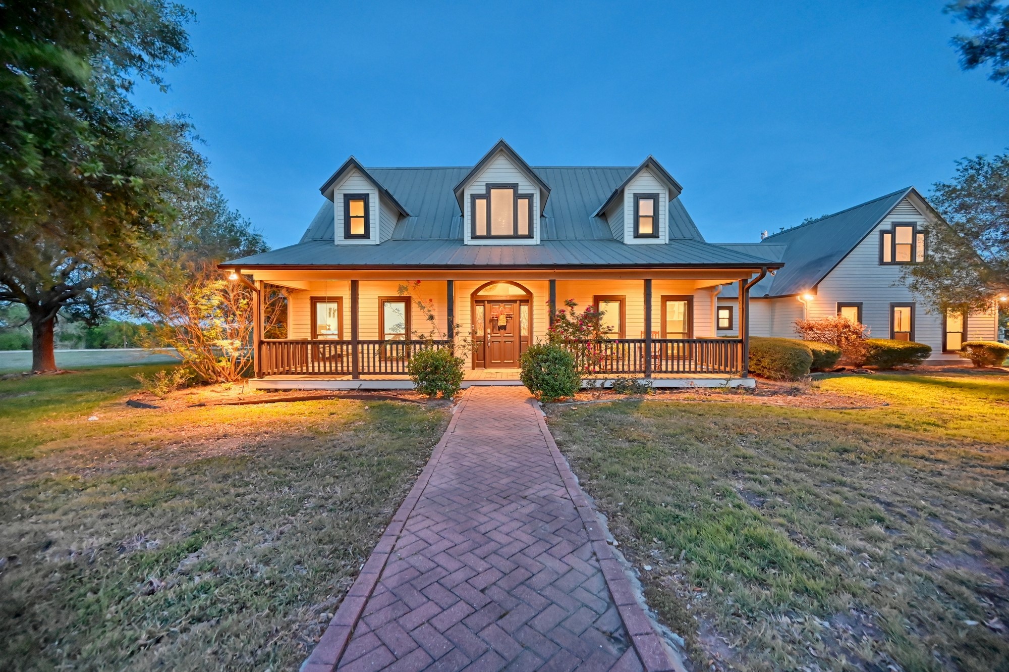 5255 Ganske Road Burton, TX 77835 - Photo 43 of 46 Just a reminder of how the gorgeous main home is at sunset!