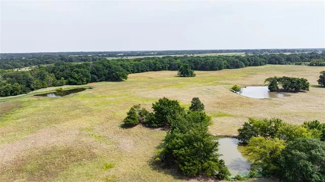 a view of a back yard of a house
