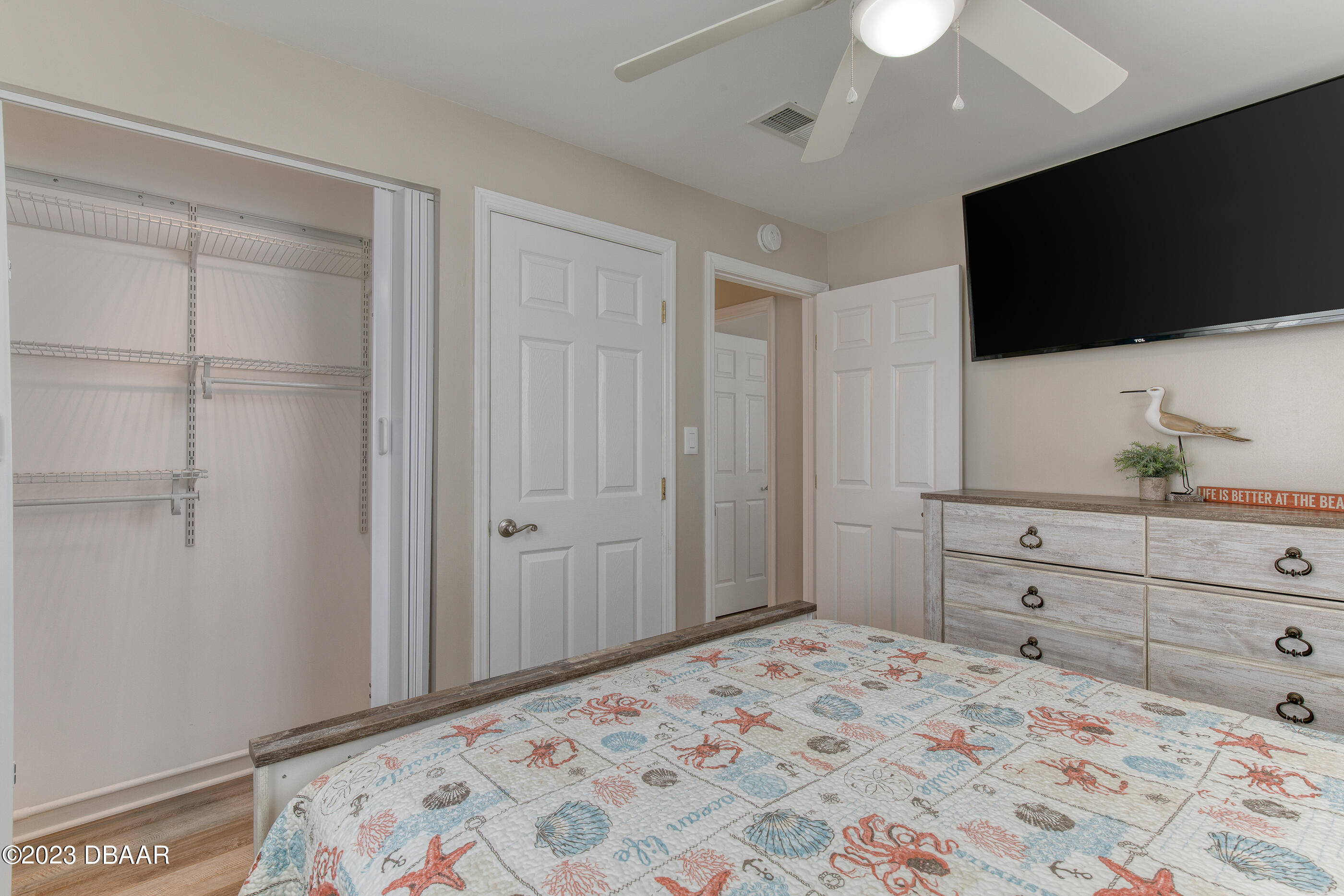 103 Roberta Road Ormond Beach, FL 32176 - Photo 19 of 56 a bedroom with a bed and a flat screen tv