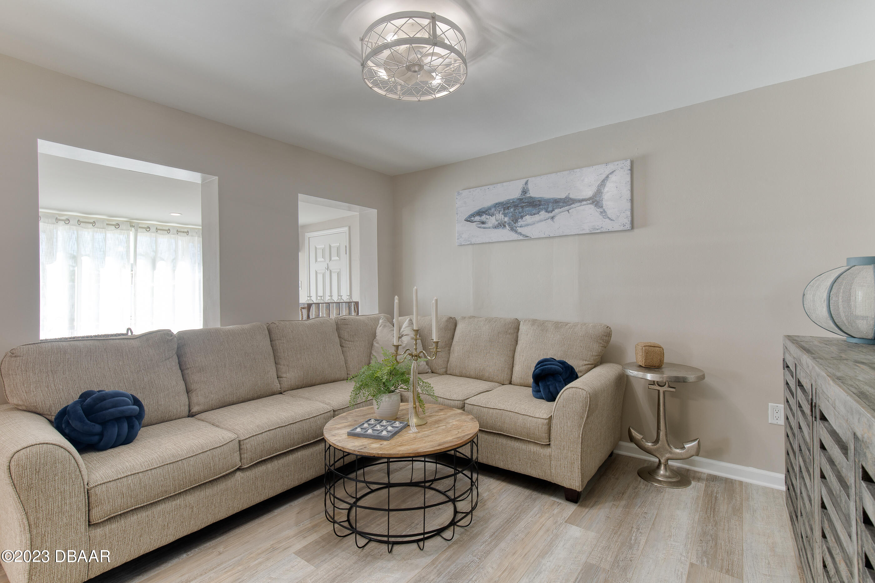 103 Roberta Road Ormond Beach, FL 32176 - Photo 21 of 56 a living room with furniture and a large window