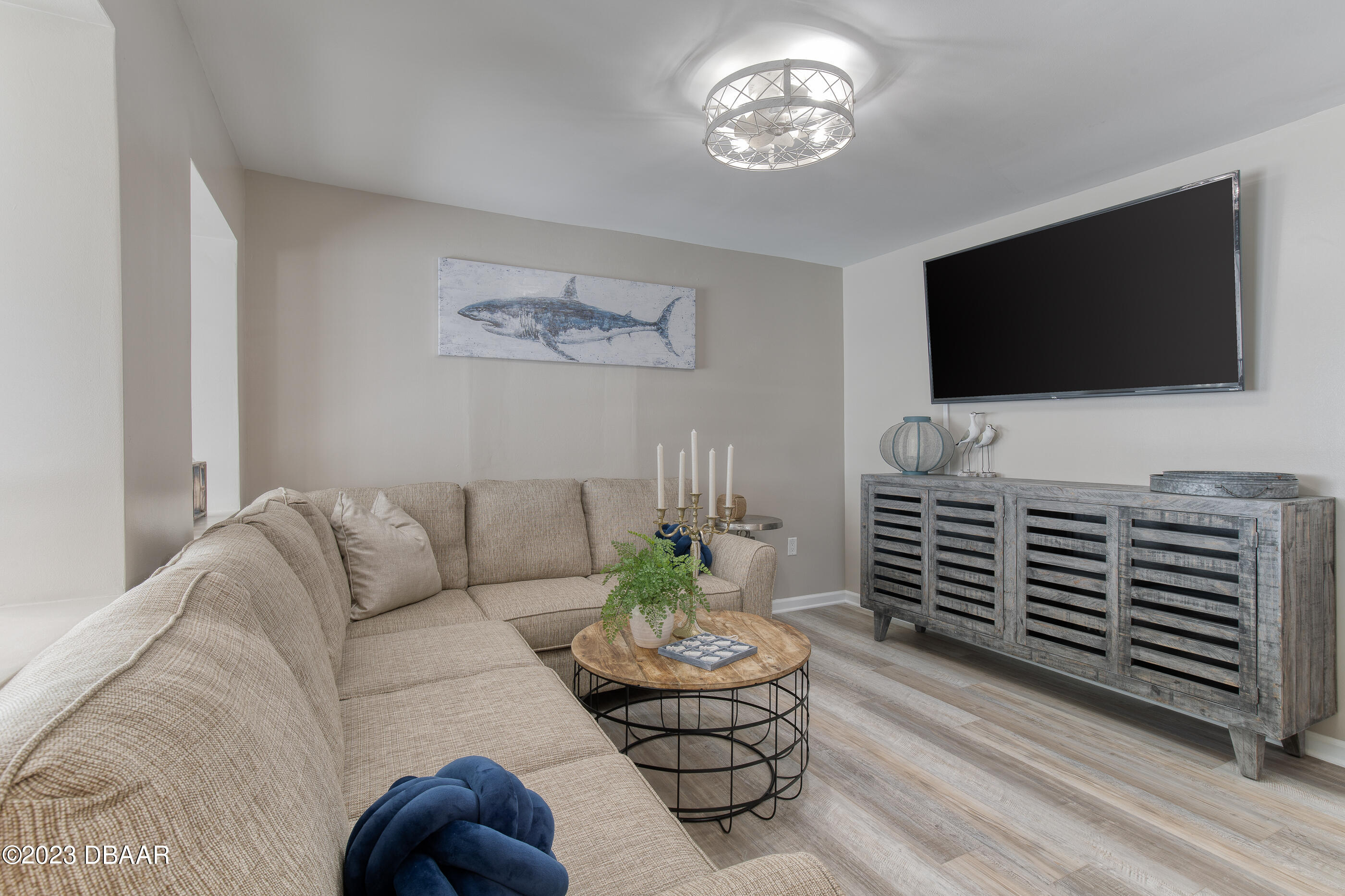 103 Roberta Road Ormond Beach, FL 32176 - Photo 22 of 56 a living room with furniture and a flat screen tv