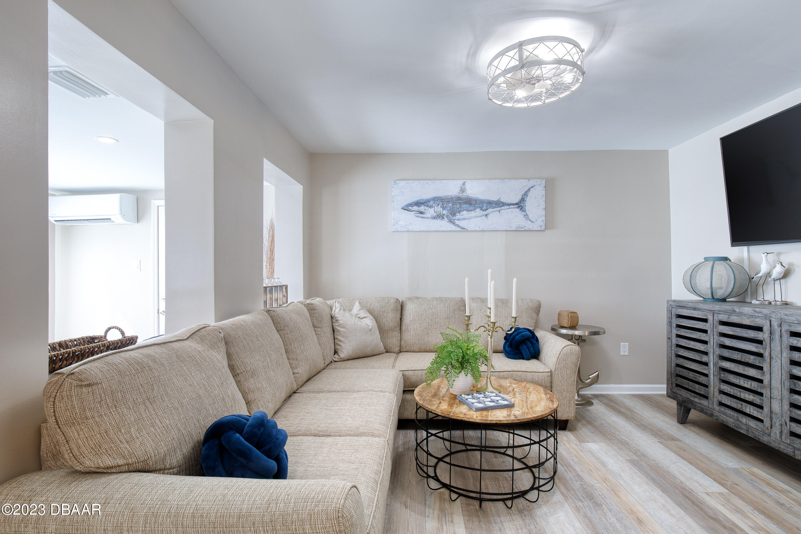 103 Roberta Road Ormond Beach, FL 32176 - Photo 23 of 56 a living room with furniture and a flat screen tv