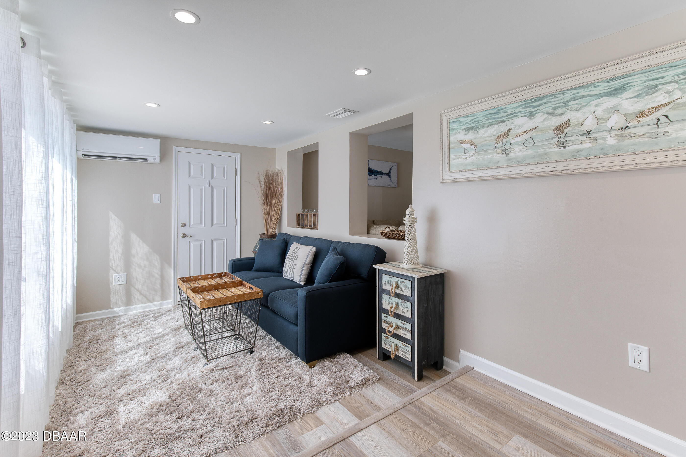 103 Roberta Road Ormond Beach, FL 32176 - Photo 7 of 56 a living room with furniture and wooden floor