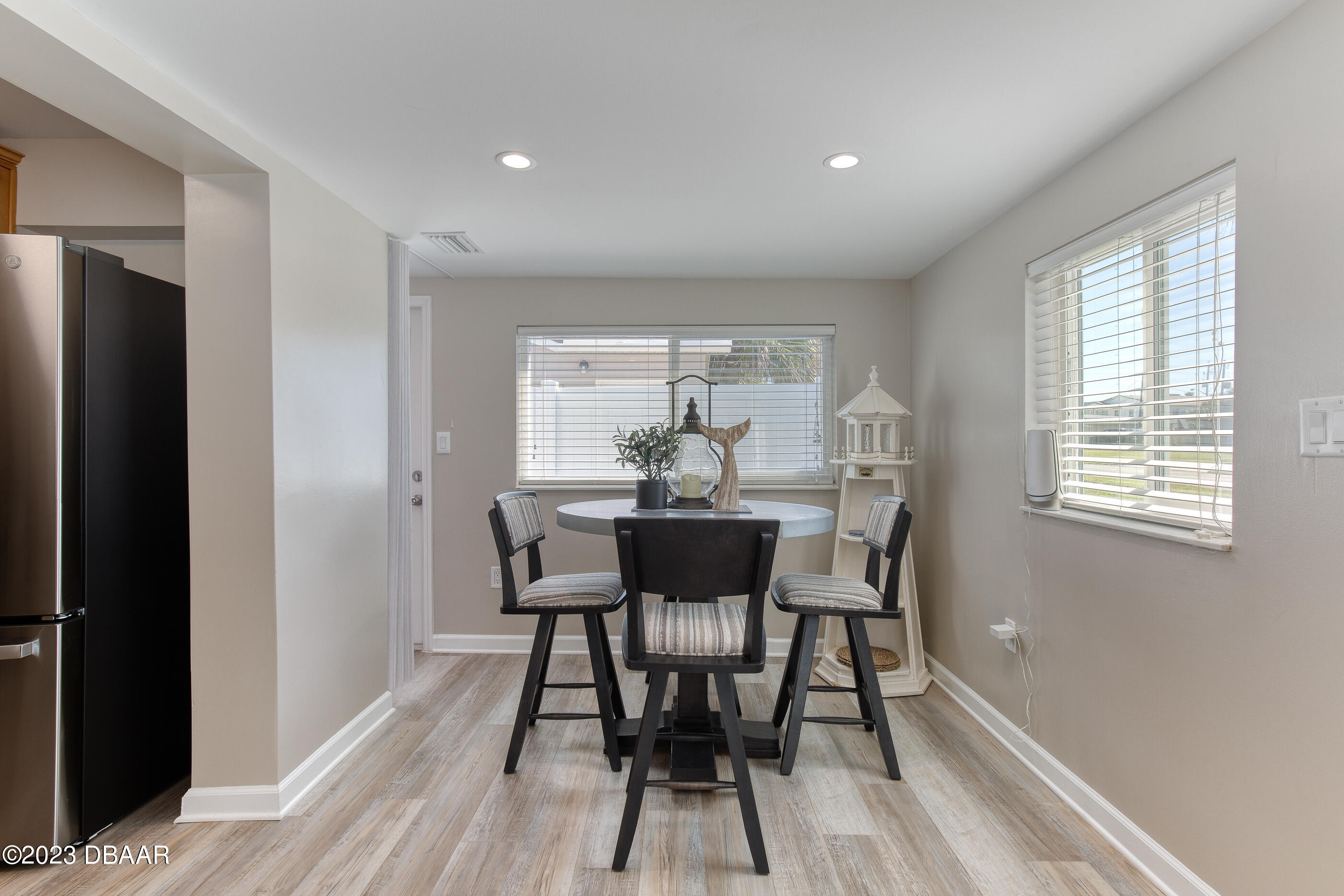103 Roberta Road Ormond Beach, FL 32176 - Photo 10 of 56 a view of a dining room with furniture and wooden floor